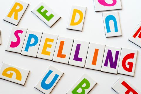 The word "spelling" in colorful letters on white background.