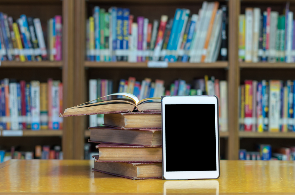 books, e-reader, library background