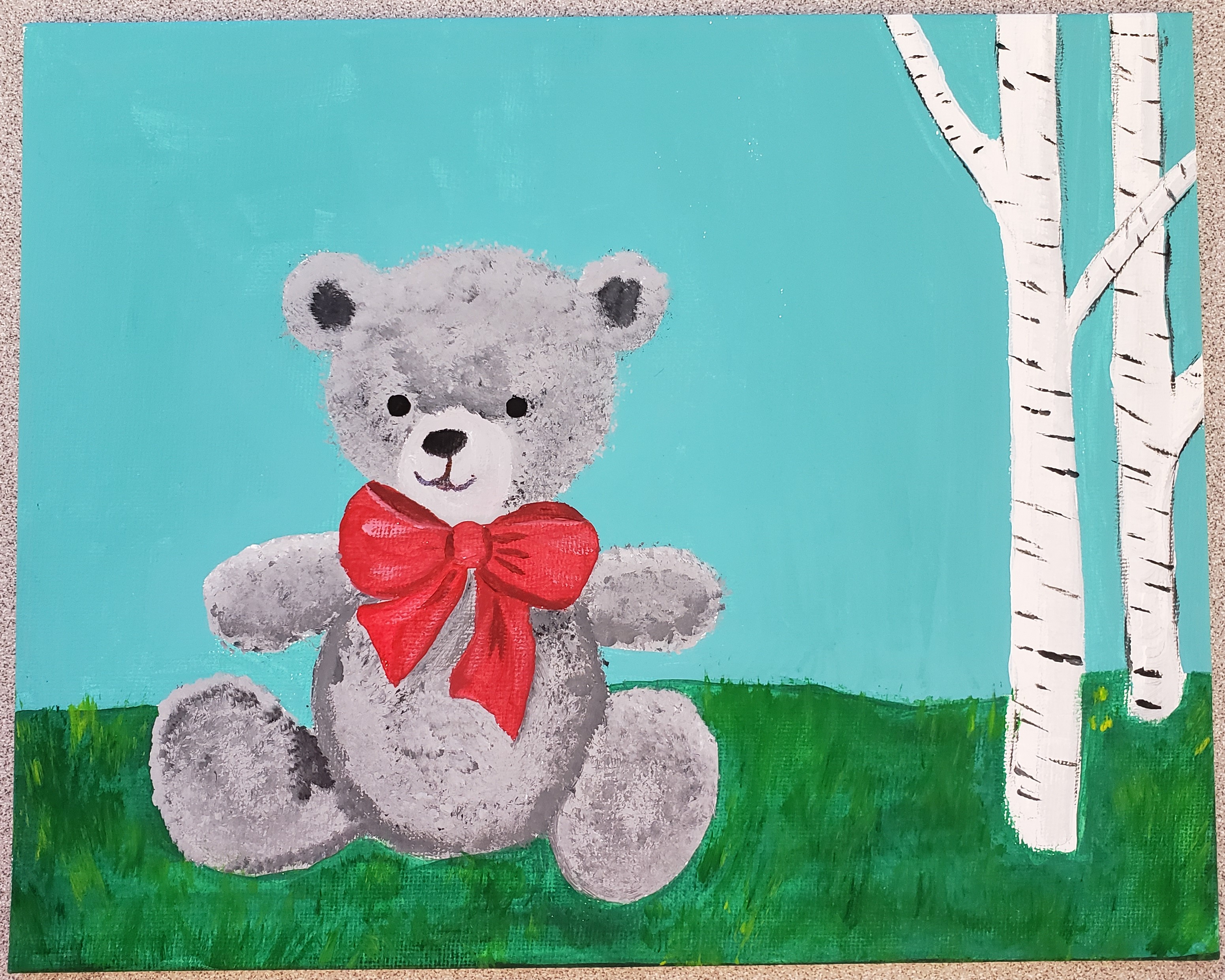 Teddy bear on grass