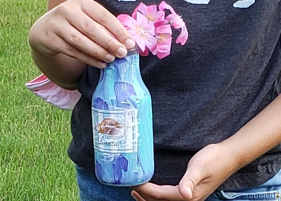 crackle bottle art in shades of blue with pink flowers