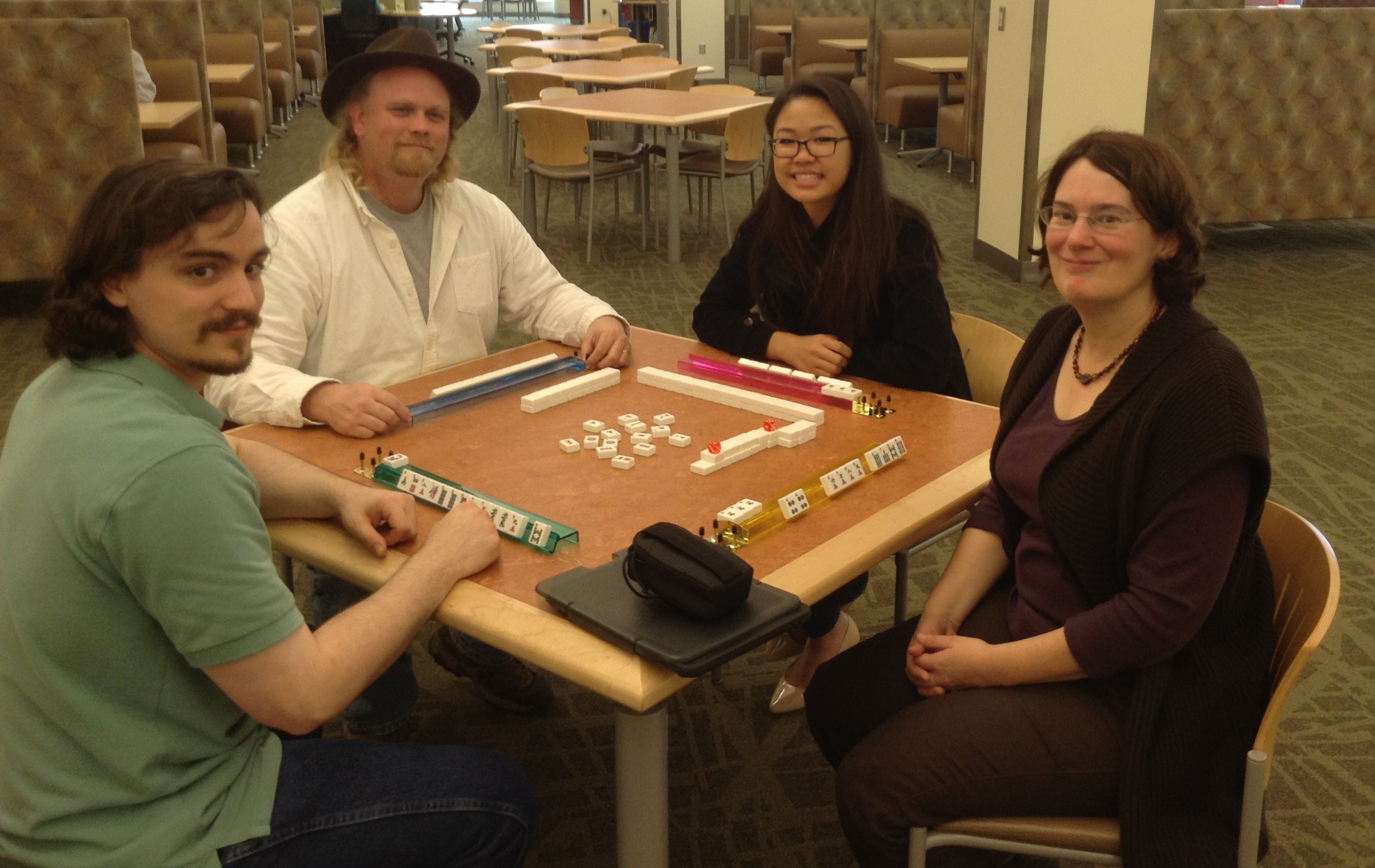 Group of people playing Mahjong