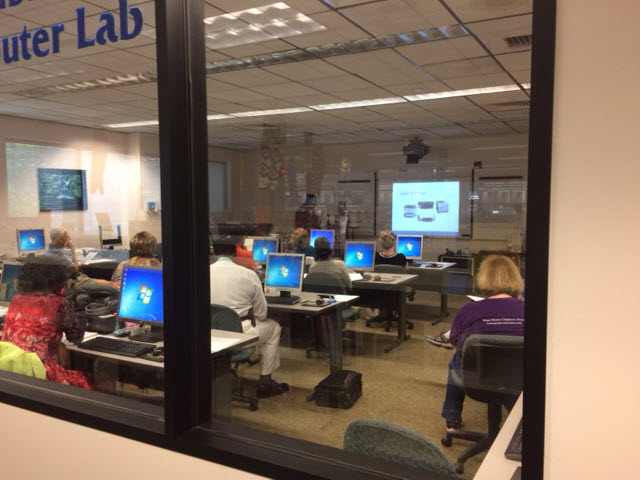 A picture showing a program taking place in a computer lab.