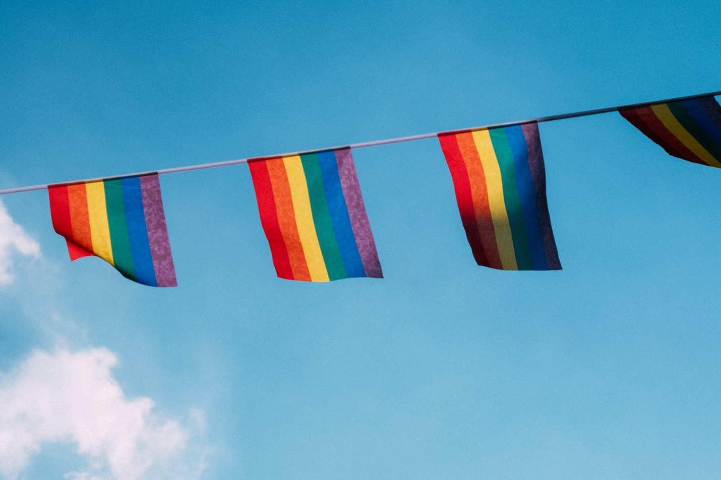 Rainbow flags on a clothesline