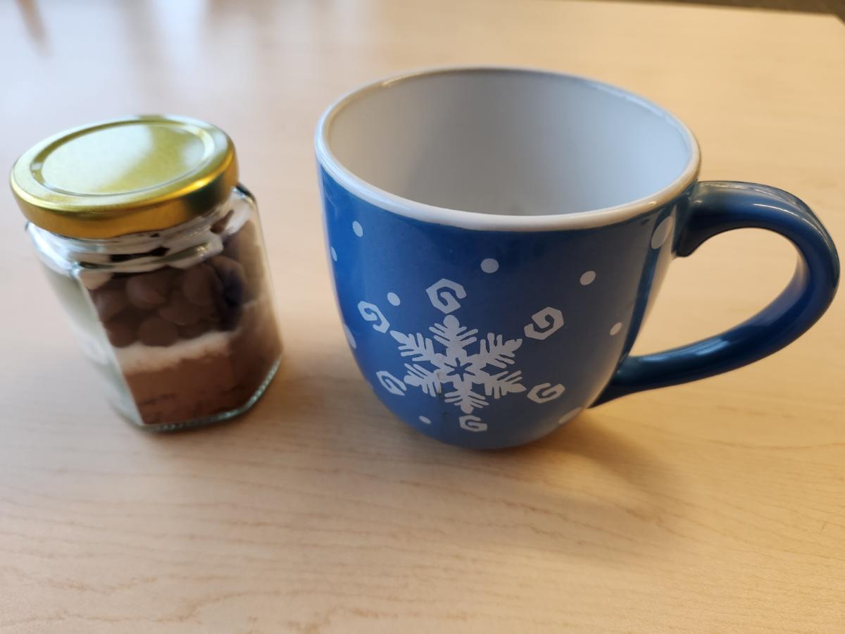 Sample jar of hot cocoa and mug