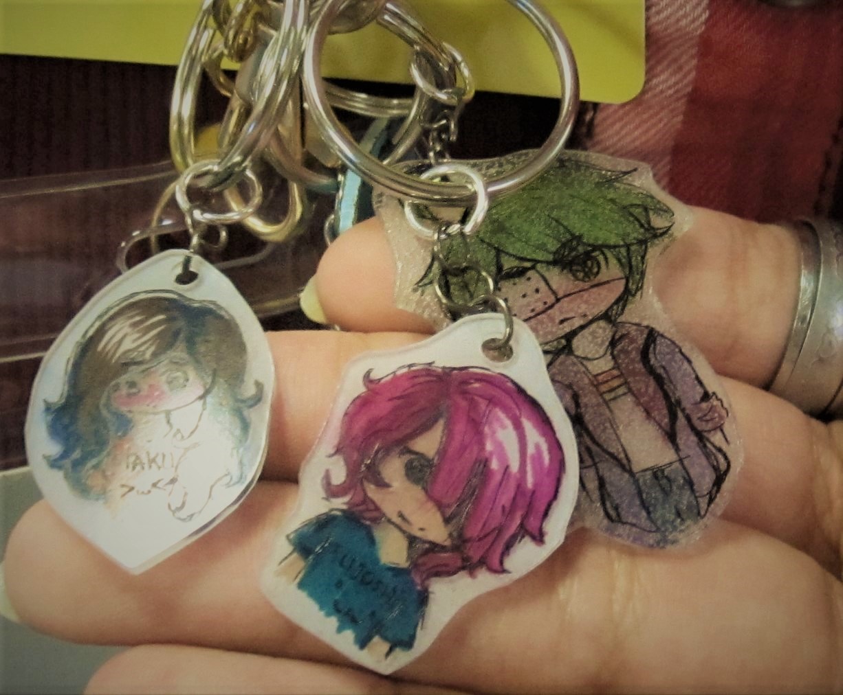 Shrinky Dink charms in hand