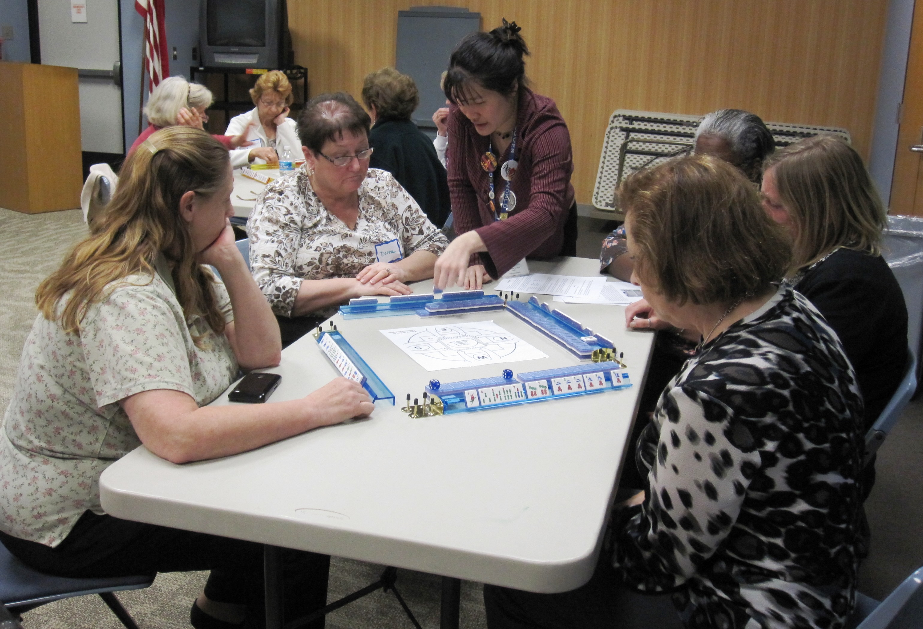 Adults playing mahjong