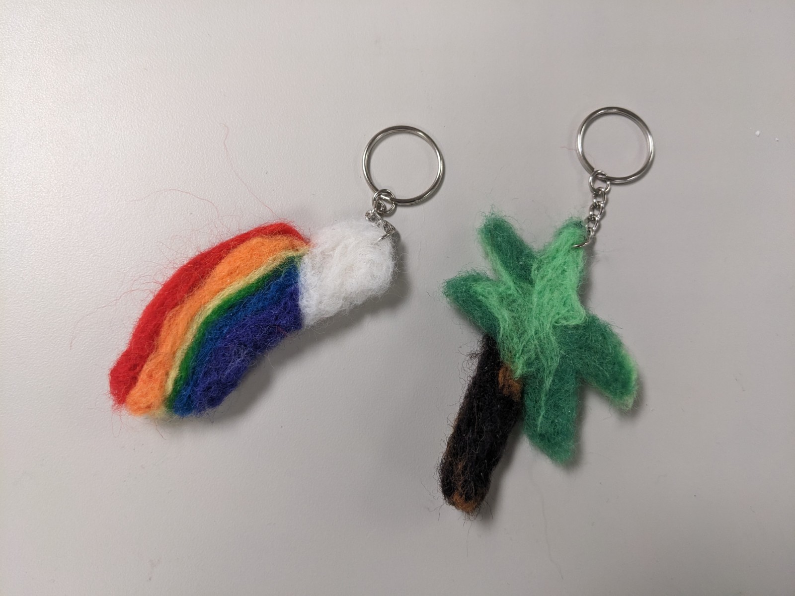 felted rainbow keychain and felted palm tree key chain