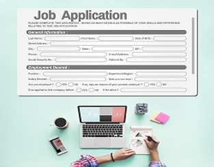 Job application and desk of person filling it out
