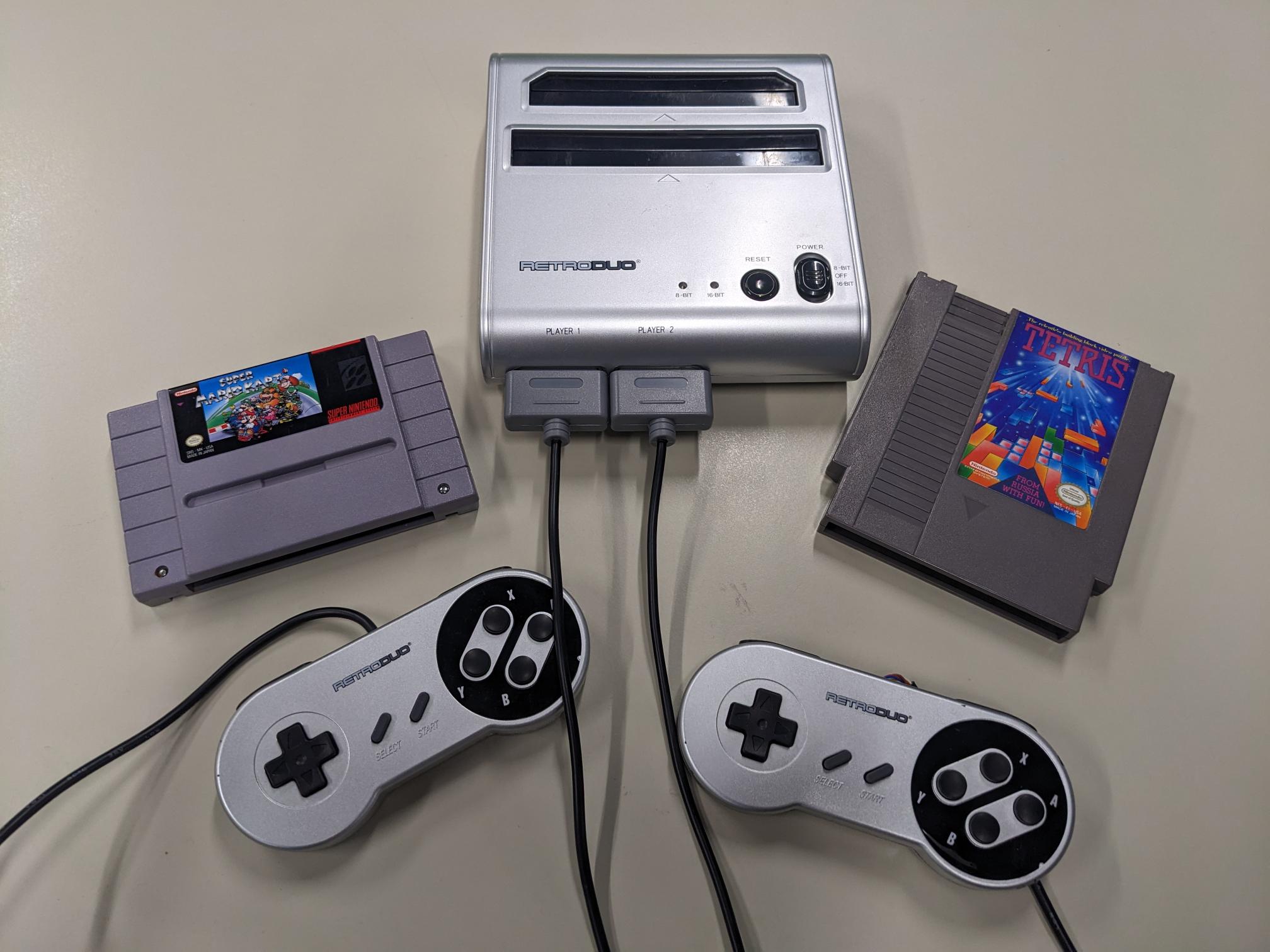 NES and SNES game system with two controllers and an NES cartridge and SNES cartridge