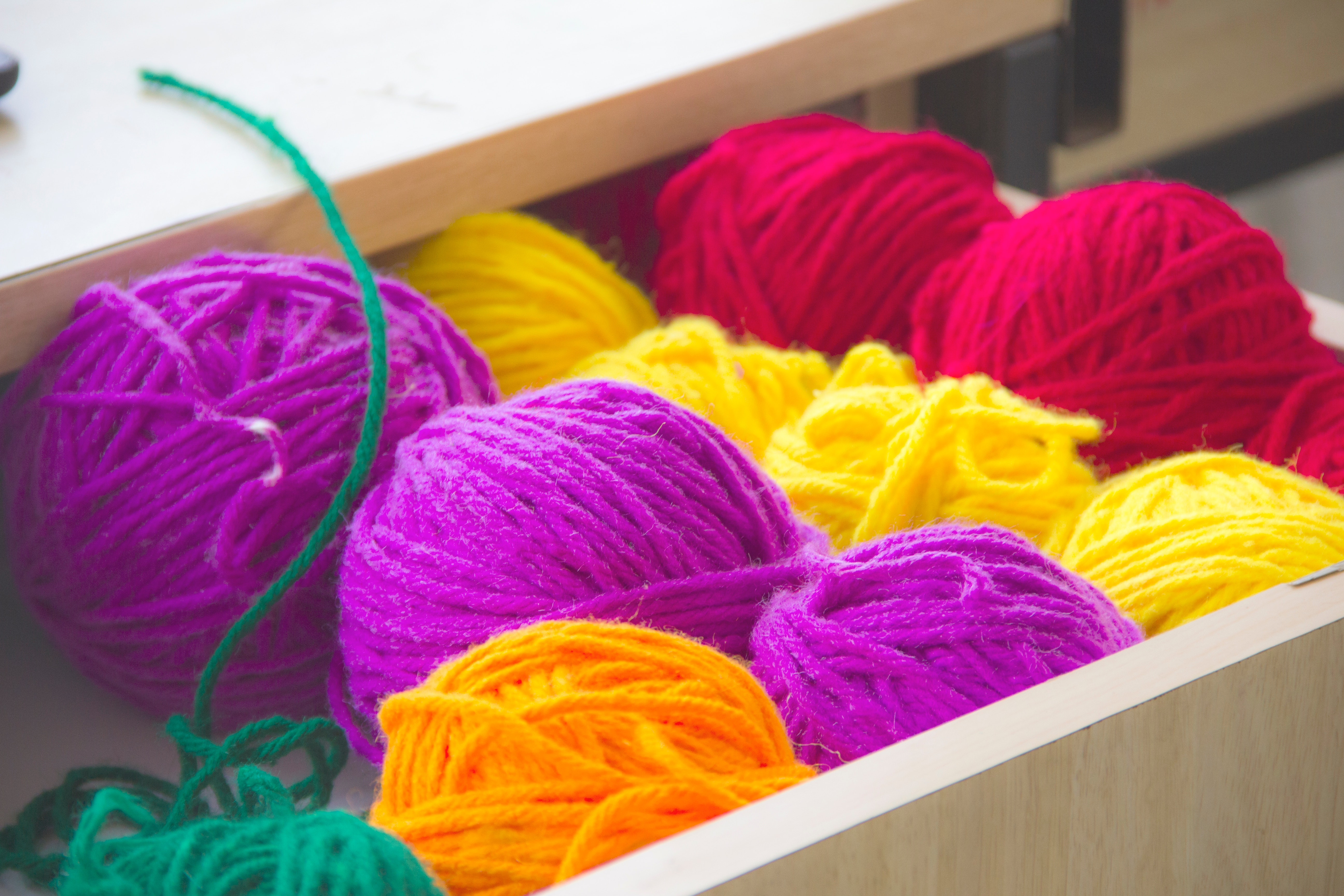 colorful balls of yarn in a box