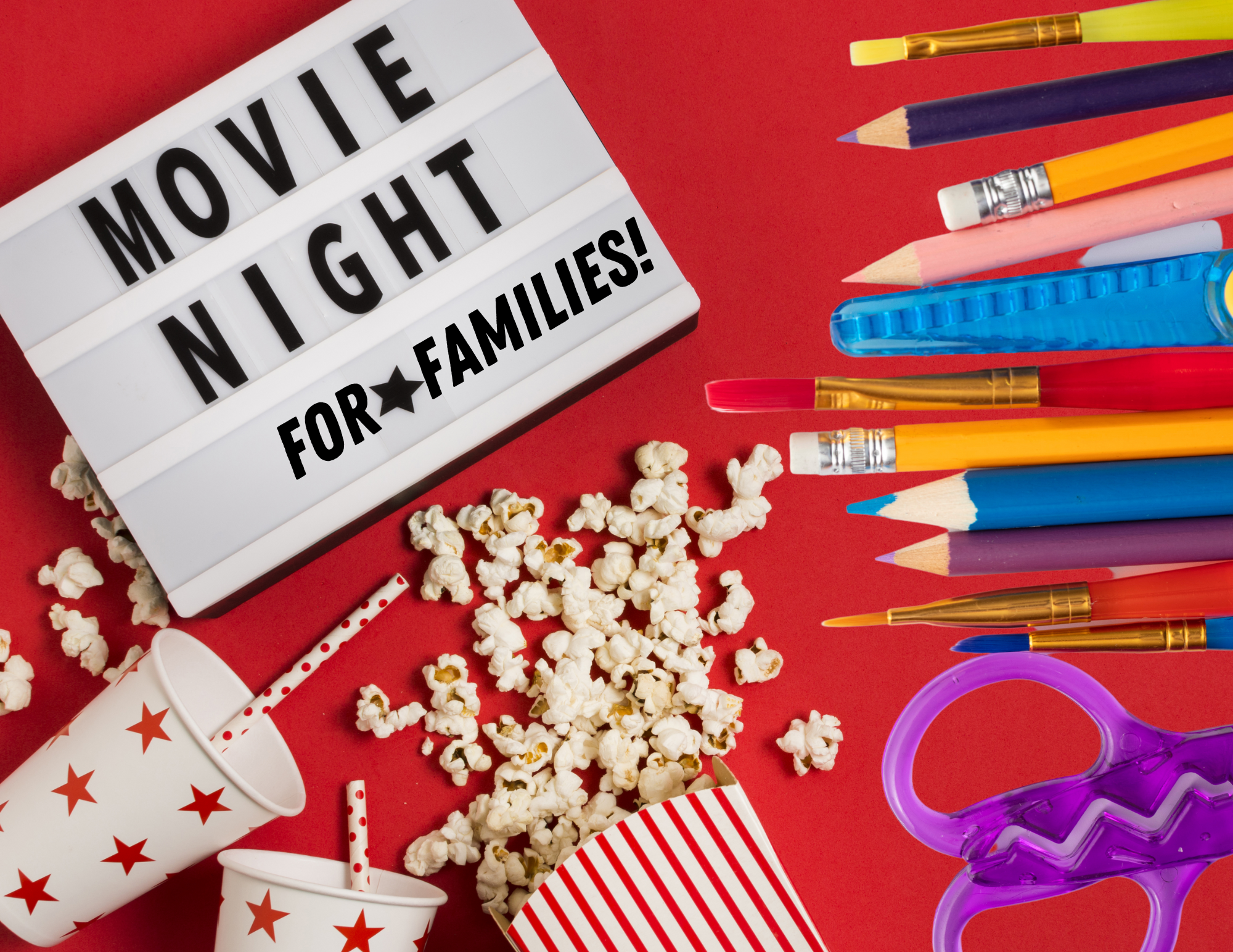 Sign reads "movie night for families" surrounded by popcorn and art supplies