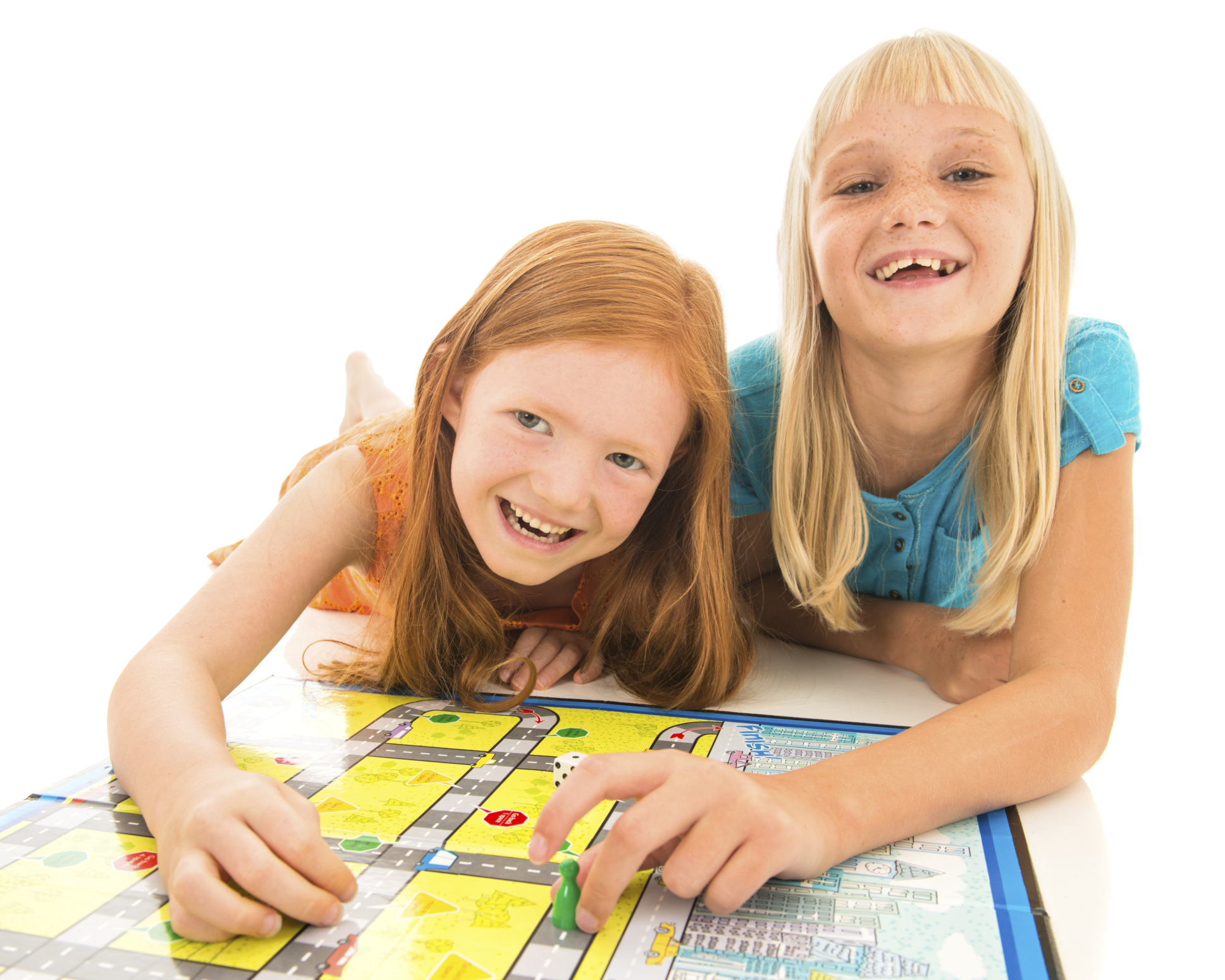 Two girls playing a board game.