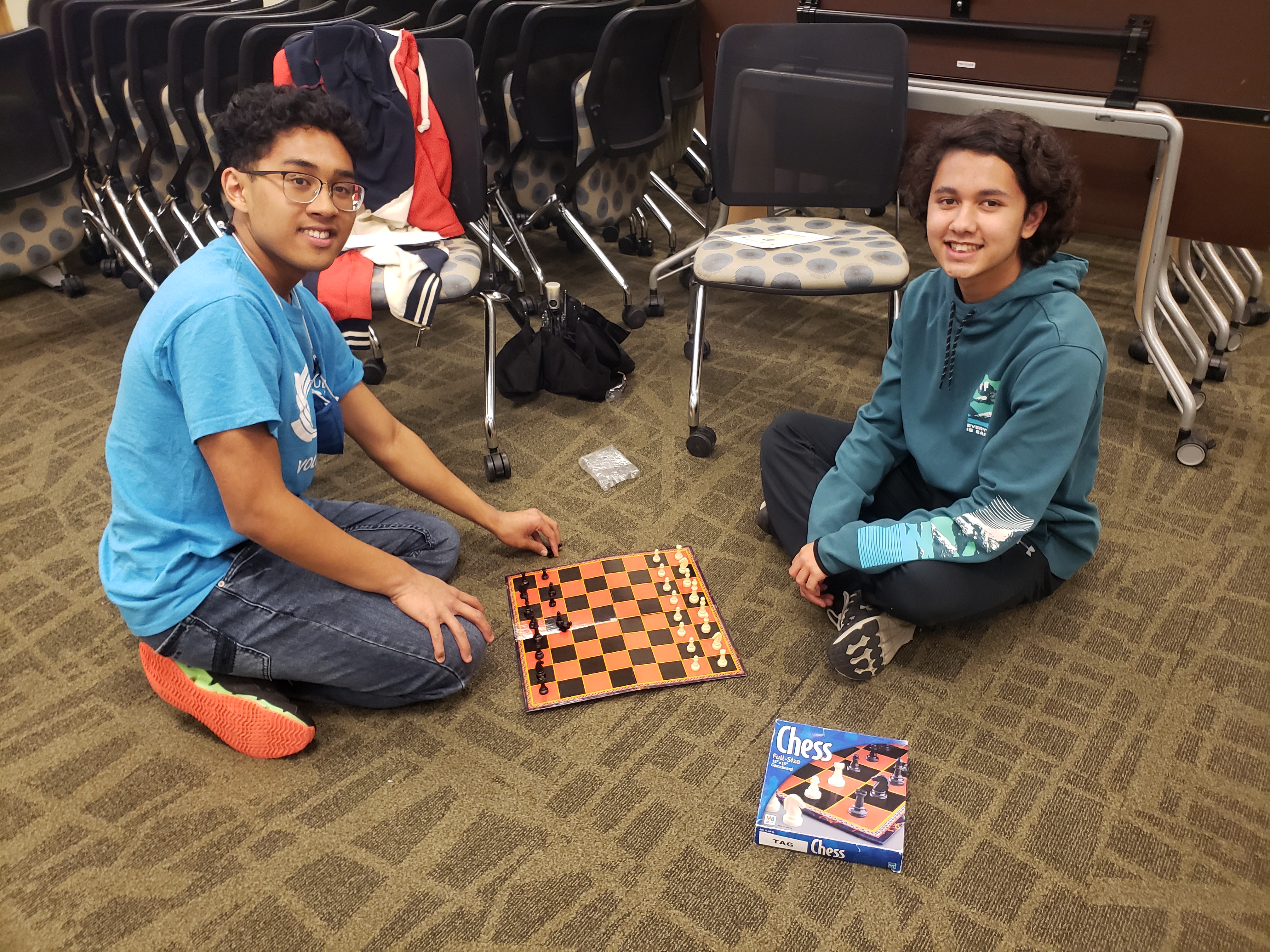 Two teens playing Chess