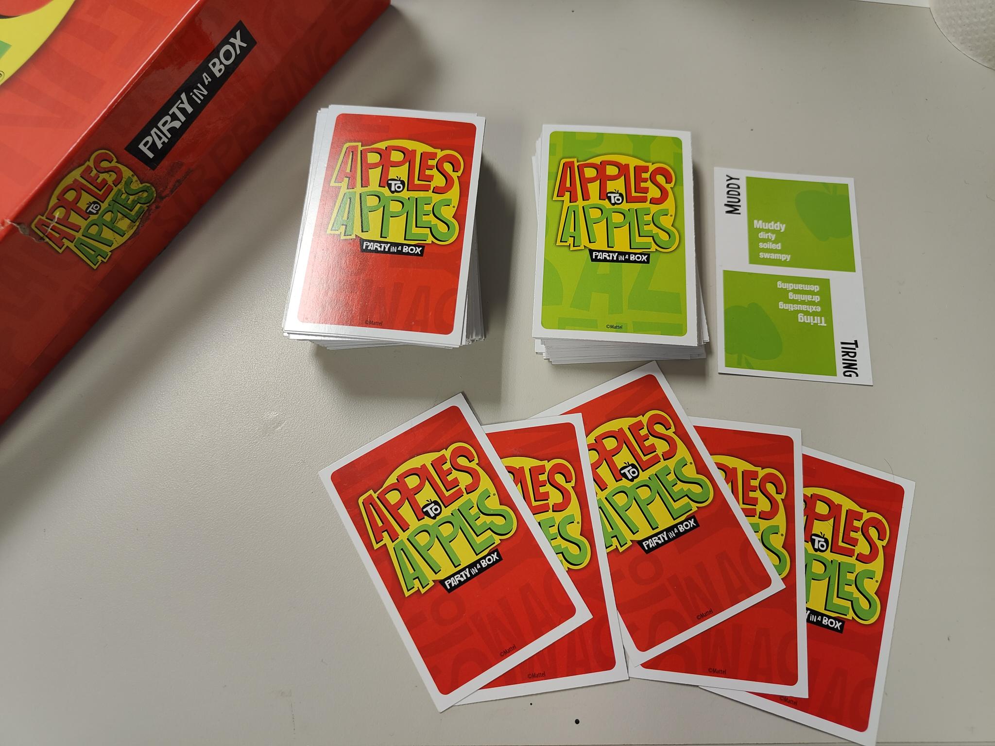stacks of red and green Apples to Apples cards
