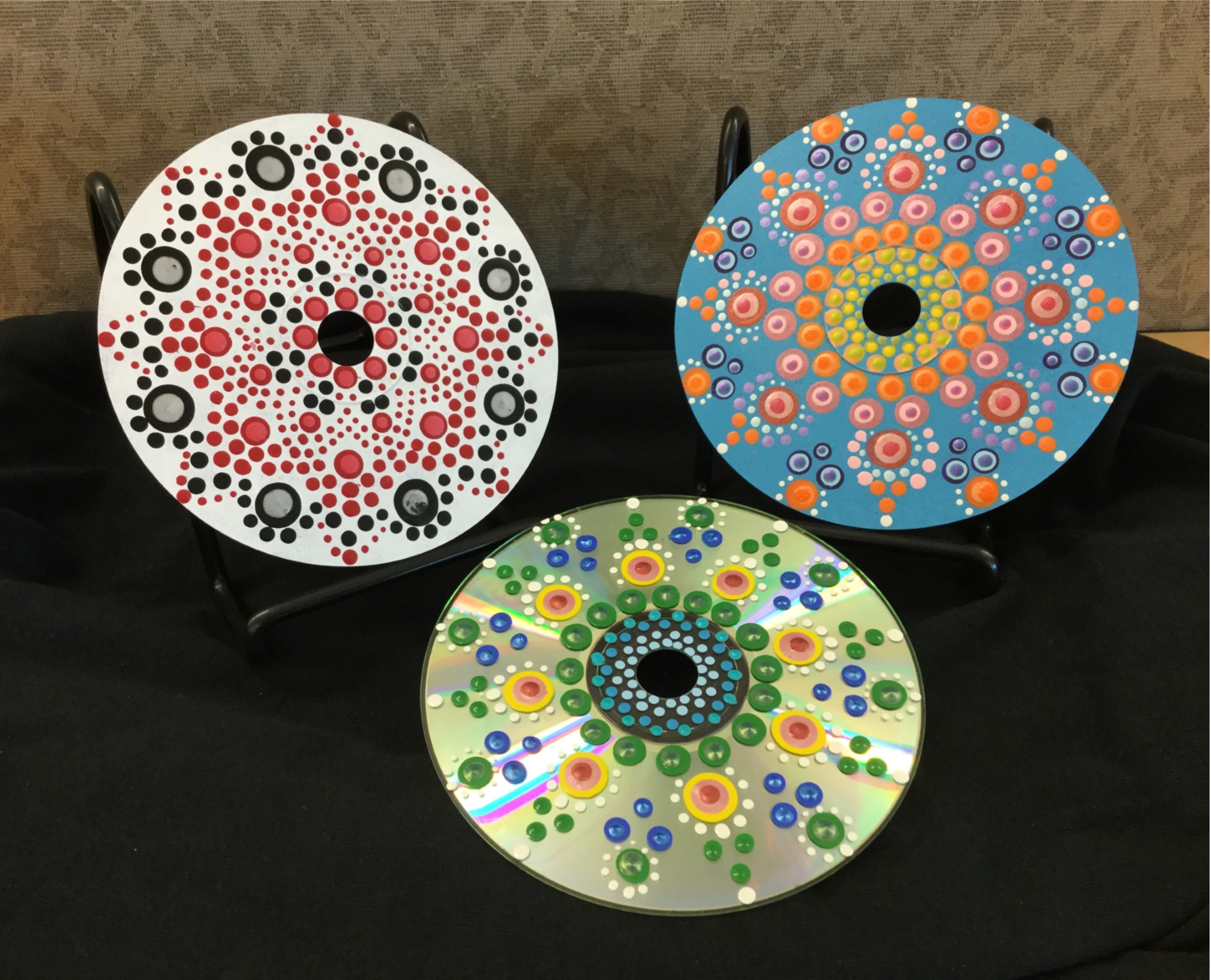 Sample of recycled CD craft with dotted paint