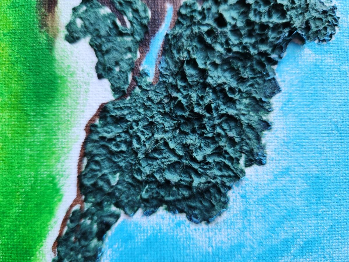 Textured green tissue paper on painted canvas.