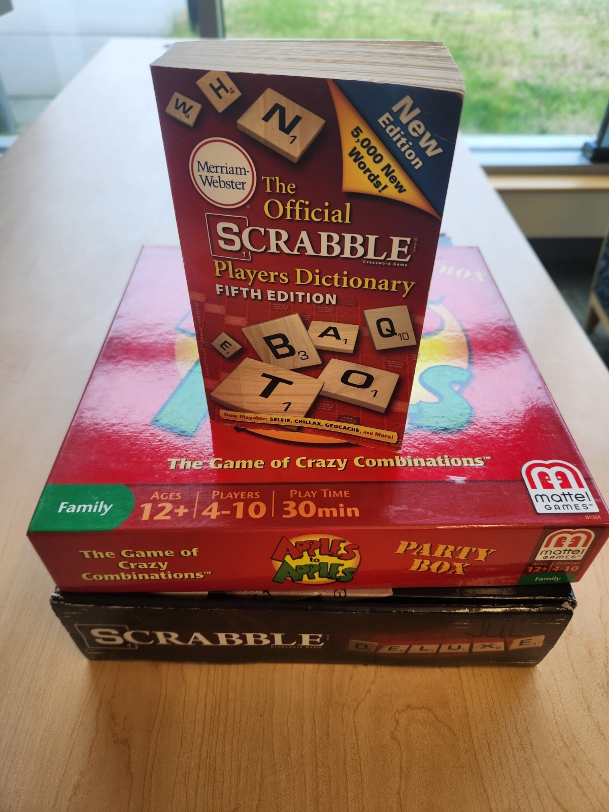 Scrabble Dictionary on top of Apples to Apples game and Scrabble game.
