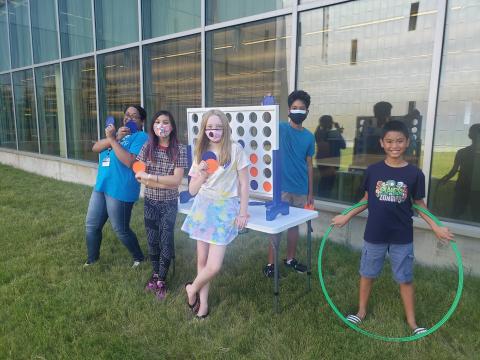 Group of teens playing Connect 4