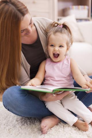 child mother reading happy excited book