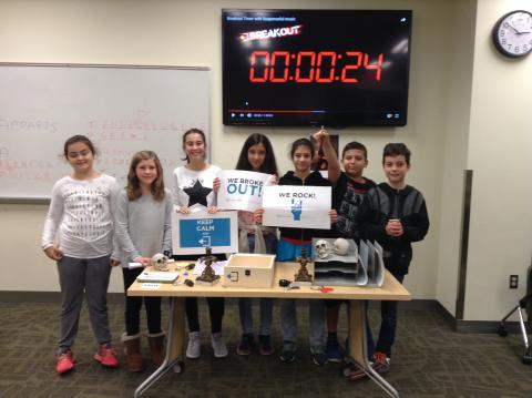 Group of tweens playing Escape the Room