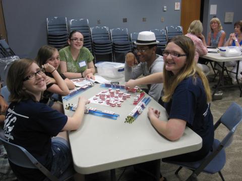 group of teens playing mahjong