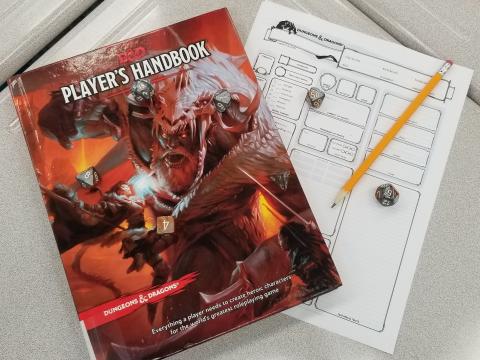 Dungeons & Dragons Player's Manual, character sheet, pencil, dice