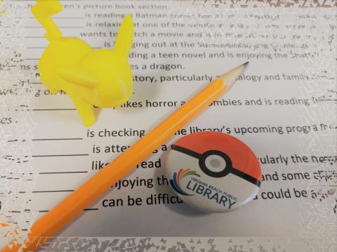 form, yellow Pikachu figure, pencil, Pokeball button