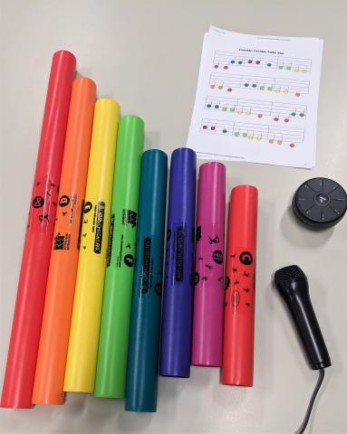 set of 8 boomwhackers, Orba, karaoke microphone, and Twinkle Twinkle sheet music for boomwhackers