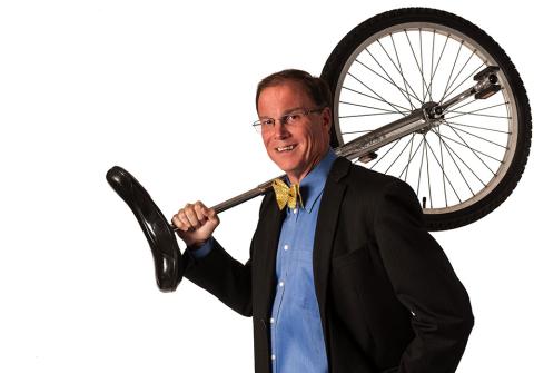 Harold Wood Holding Unicycle
