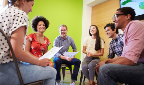 Group of people sitting in a circle conversing