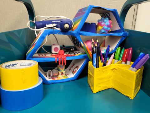 Image of small shelf and pencil holder constructed out of cardboard