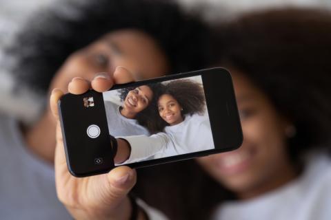 kid and mom taking selfie