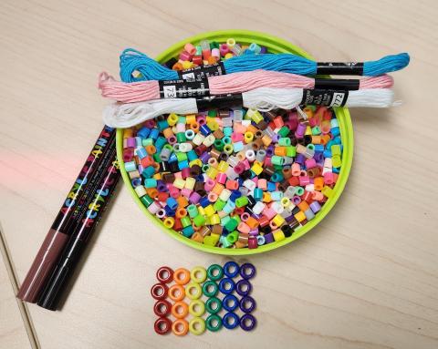 perler beads, friendship bracelet string, and acrylic paint markers