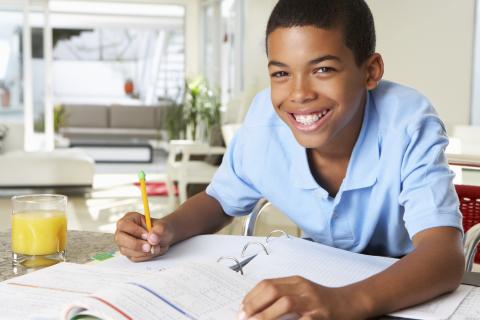 boy doing schoolwork at home