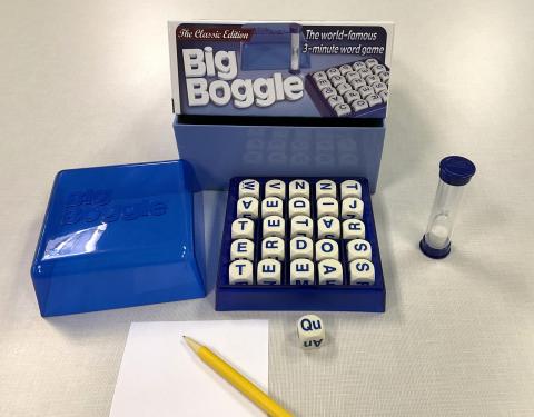 Boggle game, game box, and paper and pencil