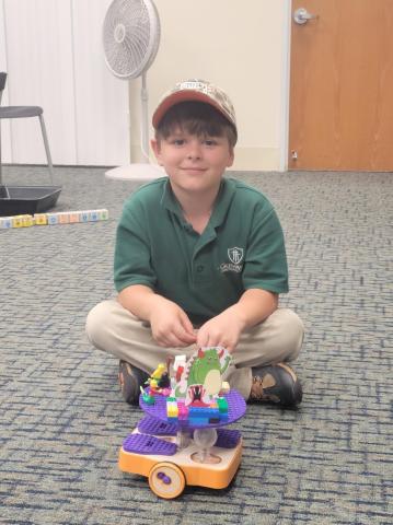 child with decorated KIBO robot