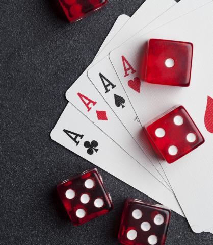 Playing cards and dice on table