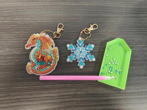 Sample of dragon and snowflake diamond art keychains