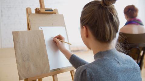 Girl drawing at an easel