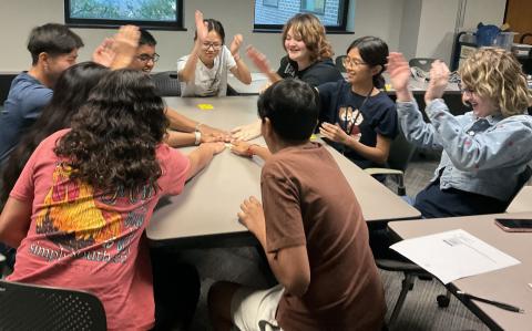 teens playing card game