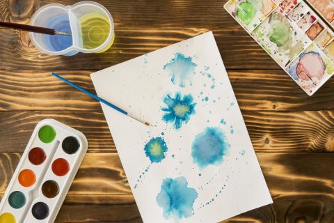 Watercolor splatters on a piece of paper.