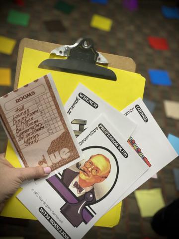 Clue game card of professor plum and clipboard