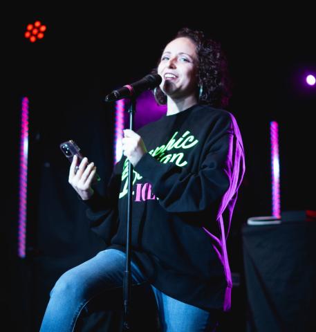 Lady performing on mic