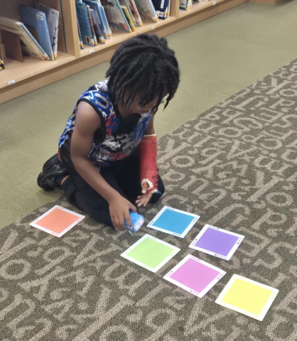 child playing with Sphero indi coding robot