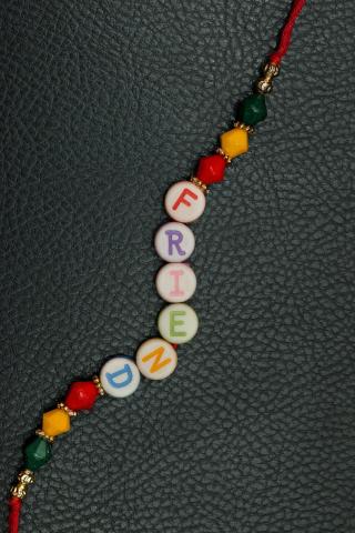 Bracelet that spells the word friend with beads