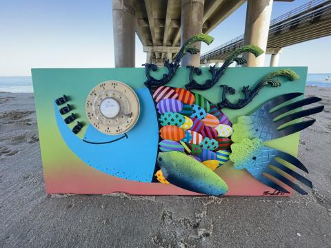Artwork of found object fish photographed beside the pier at the Oceanfront