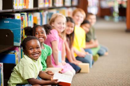 children in library smiling 