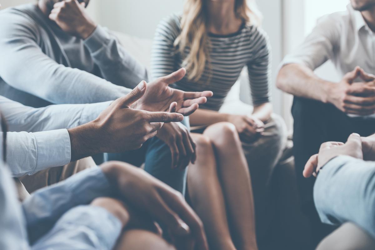 a group of people sitting in a circle