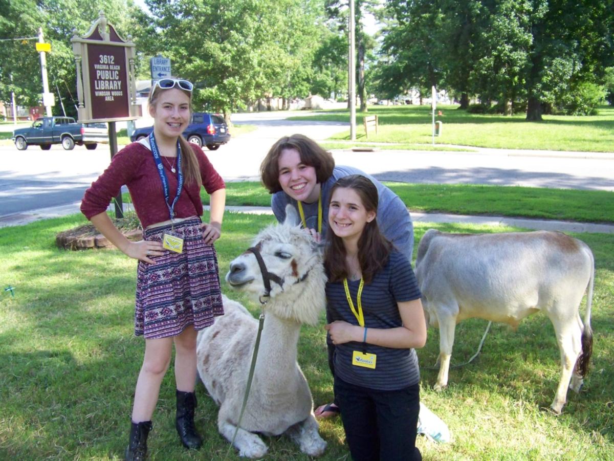 Three teen library volunteers