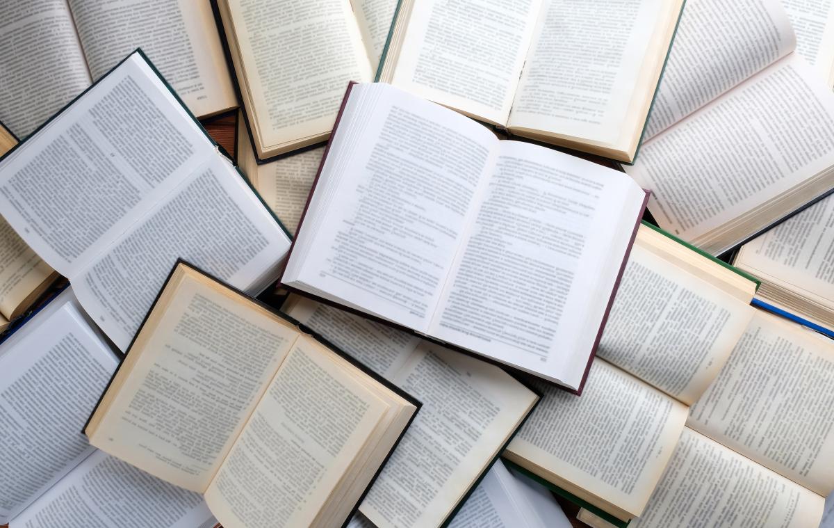 Image of piled, open books